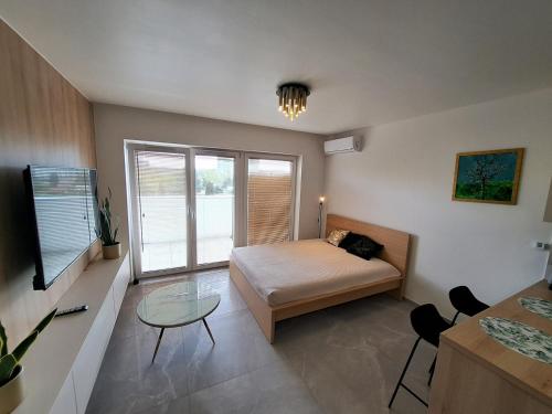 Postel nebo postele na pokoji v ubytování Kima Apartament Bażantów 29
