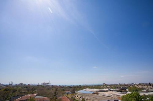 a clear blue sky over a city with houses at Marizas luxury suites #1 in Thessaloniki