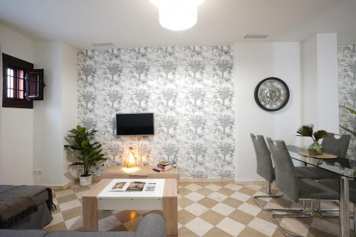 a living room with a couch and a table at ADANAR-Las Columnas in Granada
