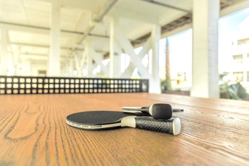 a skateboard laying on top of a wooden floor at 302 Queen Suite, 3rd Floor Low Tide in Surf City