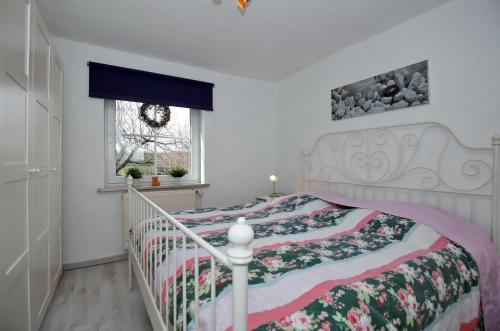 En eller flere senge i et værelse på Ferienhaus Hinter-Bollhagen