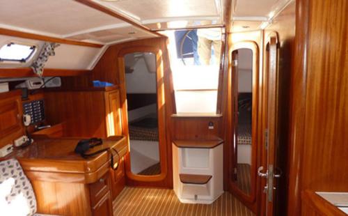 an interior of a boat with a kitchen and a room at Swing in Corfu