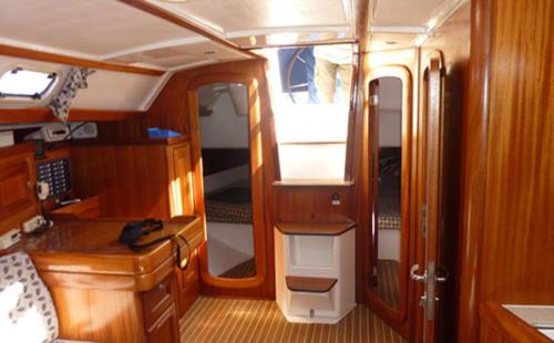 an interior of a boat with a kitchen and a room at Swing in Corfu Town