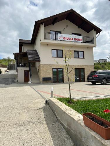 a building with a sign that reads guild house at Giulia Home in Dezmir