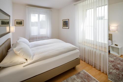 Ένα ή περισσότερα κρεβάτια σε δωμάτιο στο Aparthotel Familie Hugenschmidt