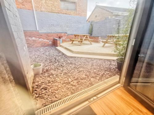 a view of a patio from the window of a house at Valletta House Holiday Apartments in Skegness
