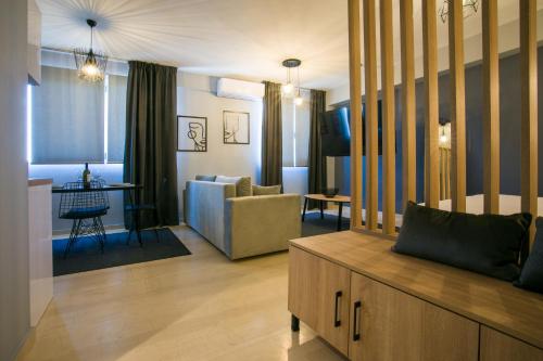 a living room with a couch and a table at marizas luxury suites #2 in Thessaloniki