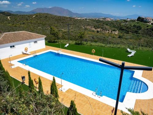 an image of a swimming pool at a house at Small Oasis Nelson Mandela Apartment with sea view, two bedrooms, parking, terrace and pool in Manilva