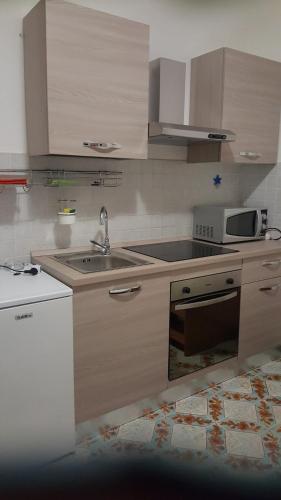 Kuchyň nebo kuchyňský kout v ubytování piccolo monolocale al porticciolo