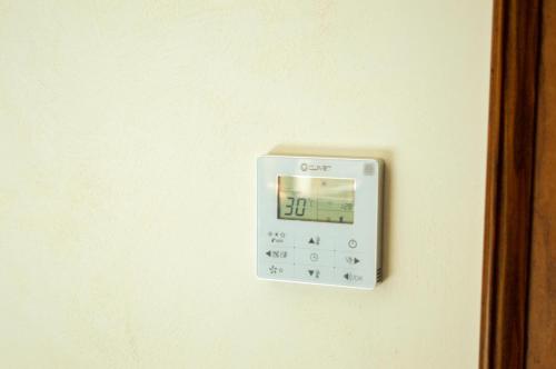 an alarm clock on a wall with a clock on it at Palazzo Iaquinta - Rooms, Restaurant & Wellness in Cicerale