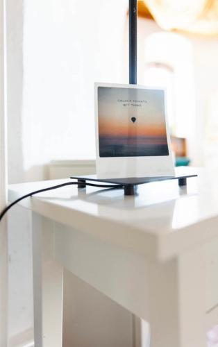a laptop computer sitting on top of a white desk at Schloßschänke Eysölden in Thalmässing