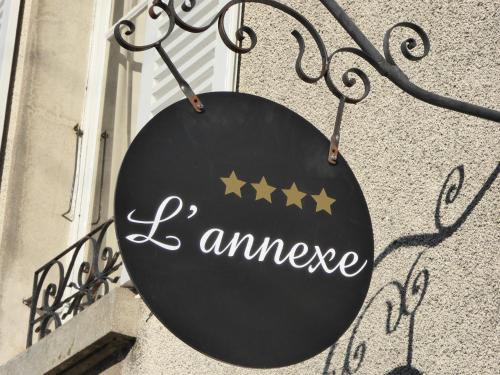 a sign that says i amnance hanging on a building at L'Annexe du 8 in Besançon
