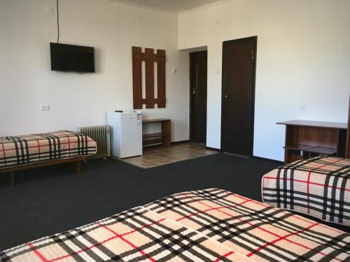 Una cama o camas en una habitación de Wings Art
