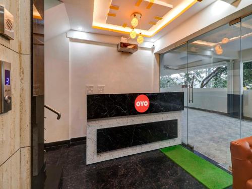a lobby with a stop sign on the wall at Global Stay Near Kengeri Bus Terminal Metro Station in Bangalore