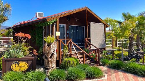 a small house with a sign in front of it at Paraíso del Valle in Ensenada