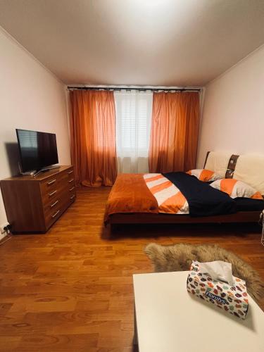 Ein Bett oder Betten in einem Zimmer der Unterkunft Orange studio