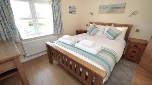 Postel nebo postele na pokoji v ubytování Bramley Cottage