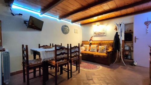 a living room with a table and a couch at A BULLACCO With Parking in Gaeta