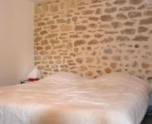 Posteľ alebo postele v izbe v ubytovaní Gîte Les Vignes Piscine et Spa