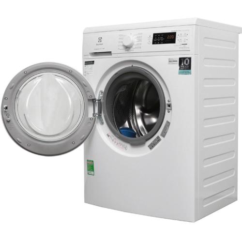 a white washing machine with its door open at Pegasy Premium Suites & Residence Westlake in Hanoi