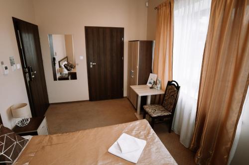 Postel nebo postele na pokoji v ubytování U Ojdanów