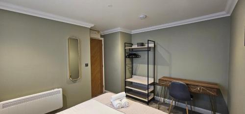 a dressing room with a chair and a mirror at The Philog by Switchback Stays in Cardiff