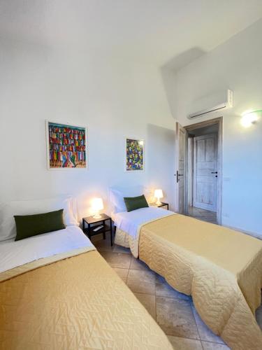 A bed or beds in a room at Appartamento La Conchiglia a pochi passi dal centro