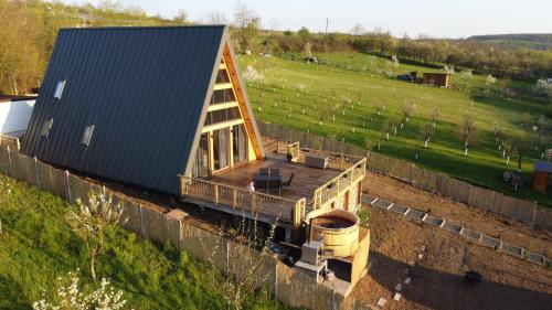 an overhead view of a house with a truck at Cabanele A Frame, Salciua Noua in Sălciua Nouă