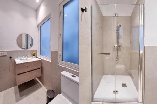 a bathroom with a shower and a toilet and a sink at Costa Getaria - Iberorent Apartments in San Sebastián