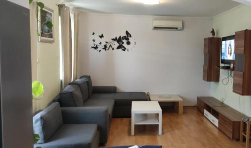 a living room with a couch and a table at Apartments Dalamar in Babino Polje