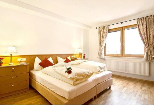 Posteľ alebo postele v izbe v ubytovaní Alpen Lodge