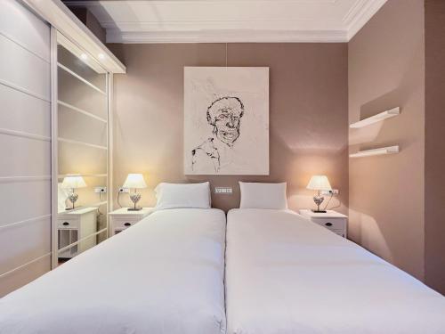 Ένα ή περισσότερα κρεβάτια σε δωμάτιο στο Stay U-nique Apartments Urquinaona