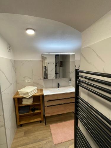 a bathroom with a sink and a mirror at Boutique Tourist Farm Hrovat in Frankolovo