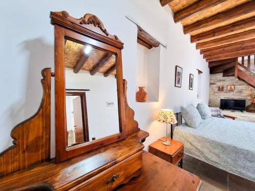 a bedroom with a large mirror and a bed at Aphrodite's Pool Retreat in Skarinou