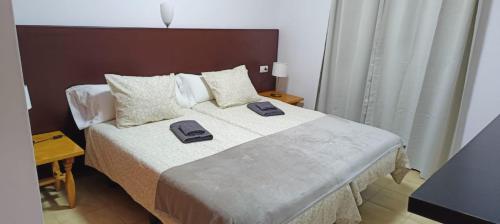 Posteľ alebo postele v izbe v ubytovaní LAGO AZUL 57