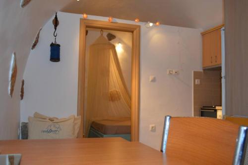 a room with a door with a curtain on it at Tholari project by S. in Astypalaia Town