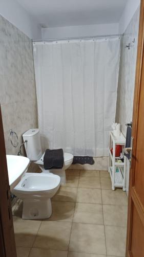 a bathroom with two toilets and a sink and a shower at LAGO AZUL 57 in Los Cancajos