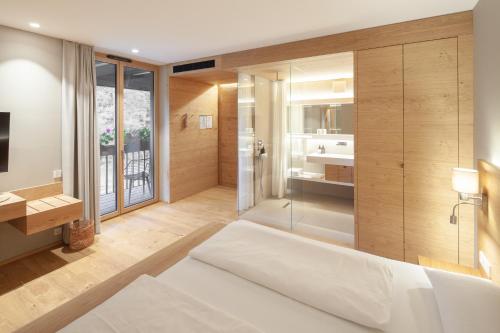Ένα ή περισσότερα κρεβάτια σε δωμάτιο στο Hotel Munde