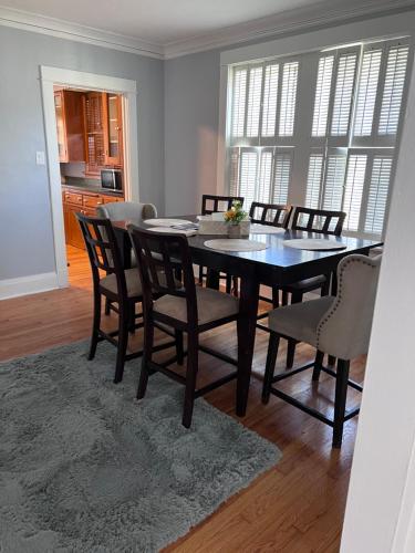 a dining room with a table and some chairs at Dale first floor in Richmond Heights