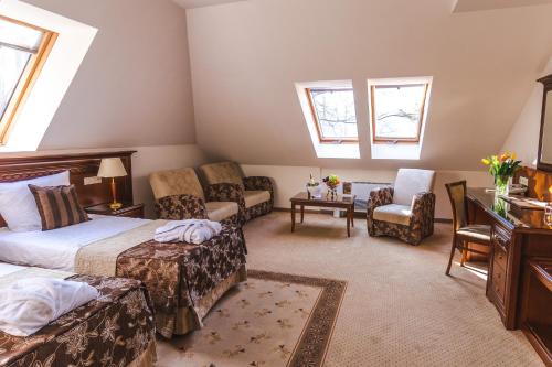 Кровать или кровати в номере Hotel Prezydent Krynica Zdrój