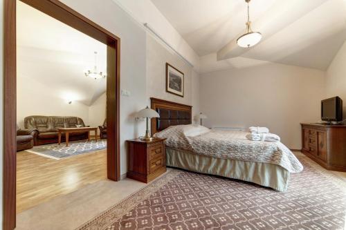 Кровать или кровати в номере Hotel Prezydent Krynica Zdrój
