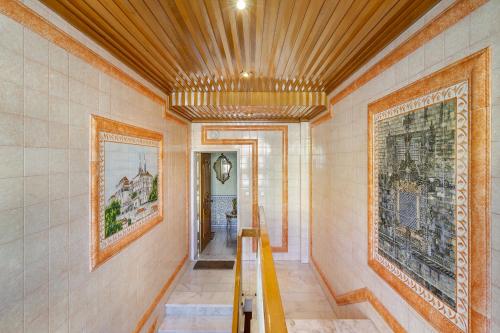 a hallway of a home with a wooden ceiling at WHome Perfect Family Hideout Residence w/AC & 4BR + 5BA in Cascais