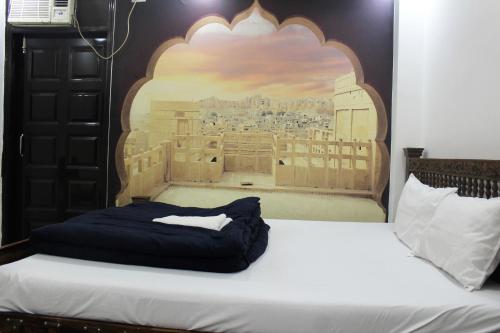 a bed in a room with a painting on the wall at Hotel Yes Boss International- Awarded Best Hotel 2025 in Budget Category in New Delhi