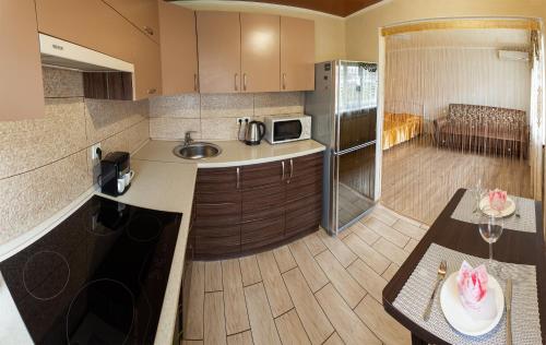 a kitchen with a sink and a counter top at Luxury apartment Gagarina street in Kryvyi Rih