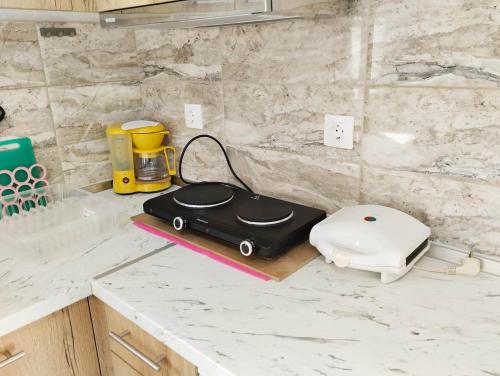 a toaster sitting on a counter in a kitchen at Nikolas' house in Nea Irakleia