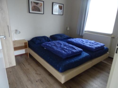 Katil atau katil-katil dalam bilik di Kustverhuur, Oude manege Nieuwvliet, Nieuwvliet 1 - 2