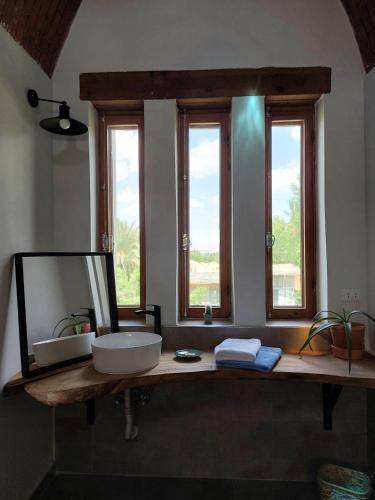a bathroom with a sink and a mirror at The Roof by Barefoot in Tunis in Tunis