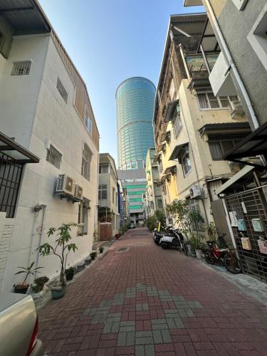 a city street with buildings and a tall building at The Apartment Number 18 in Tainan