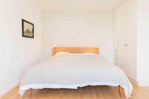 Кровать или кровати в номере Ferienwohnung Am Alpenblick