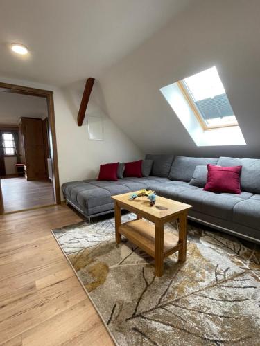 a living room with a couch and a table at Boutique Tourist Farm Hrovat in Frankolovo